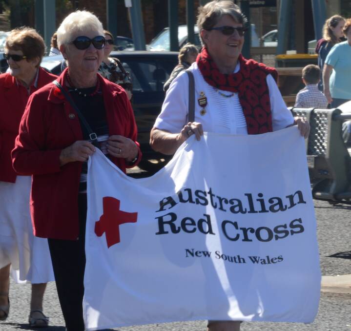 TRUE BLUE: The Ladies from the Australian Red Cross were out in full force when they marched in front a strong Coly crowd. Picture: Riley Krause.