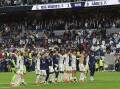 Real players applaud the fans after their defeat of Cadiz paved the way for another title triumph. (EPA PHOTO)